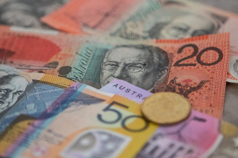 Australian dollar bills and coin, image by Squirrel photos