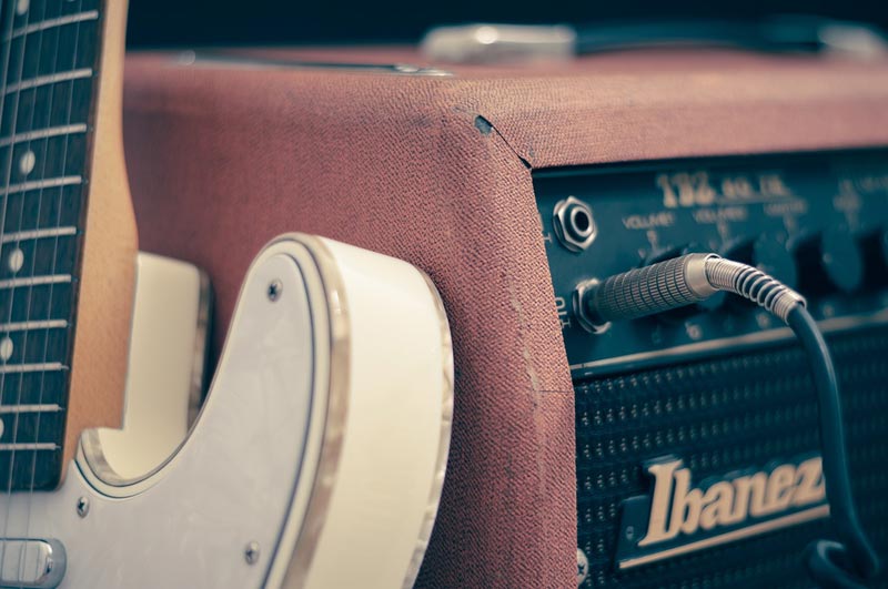 Guitar and amplifier, image by Firmbee
