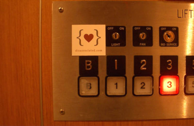 disassociated.com calling card seen in a lift
