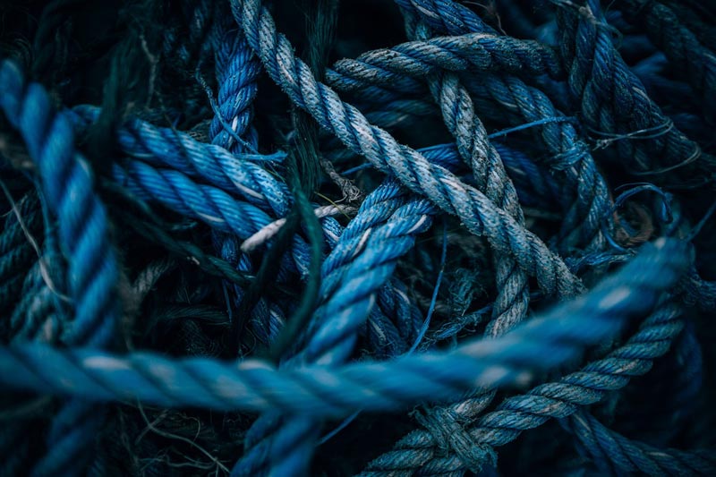 Photo of intertwined blue rope and threads, by Igor Ovsyannykov