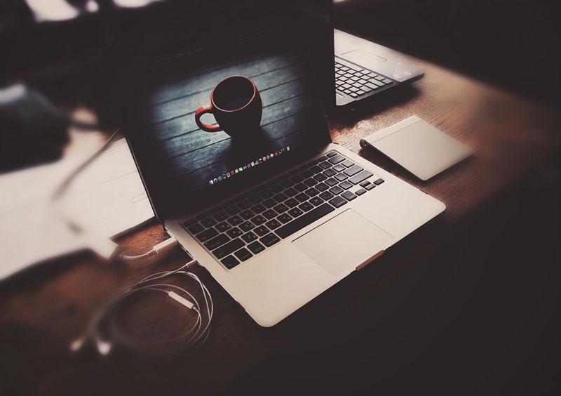 Desk with laptop, image by malcevsasha